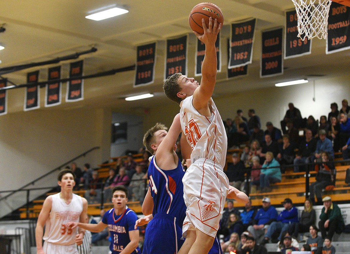 &lt;p&gt;Flathead senior Bridger Johnson goes up for a shot over Columbia Falls senior DJ Schrade during the second quarter at Flathead on Saturday. (Aaric Bryan/Daily Inter Lake)&lt;/p&gt;