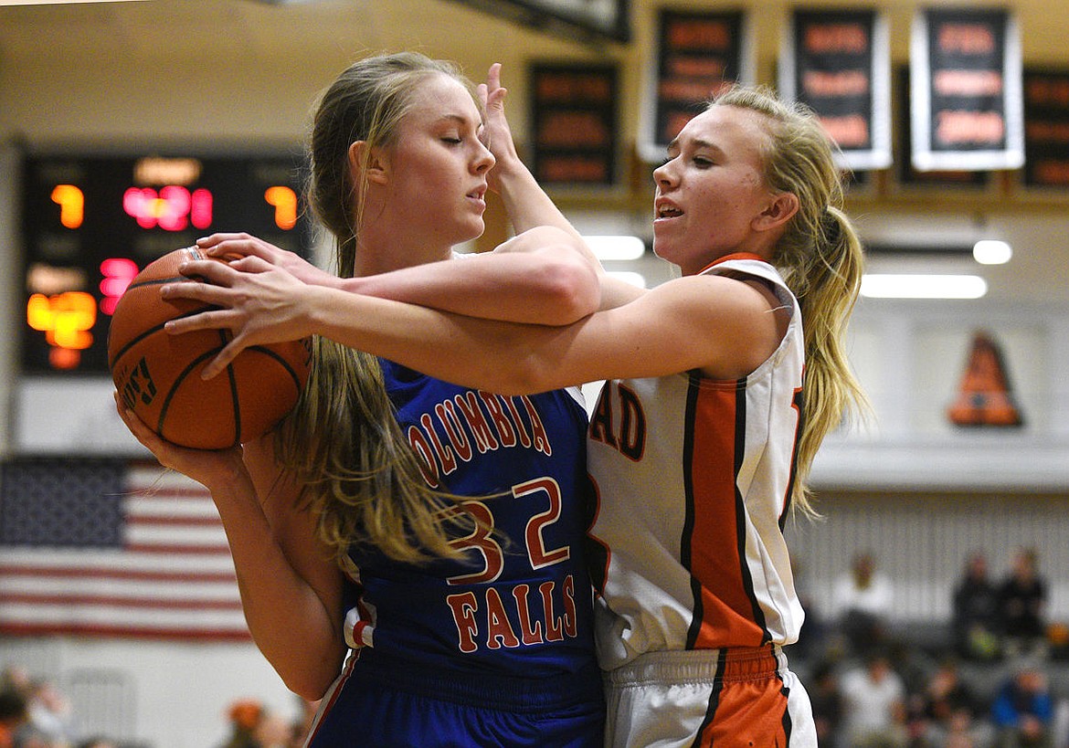 &lt;p&gt;Columbia Falls senior Kiara Burlage is guarded closely by Flathead guard Averie Olson during the fourth quarter of the Wildkats' 57-42 victory at Flathead on Saturday. (Aaric Bryan/Daily Inter Lake)&lt;/p&gt;