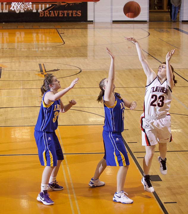 &lt;p&gt;Flathead's Kelly Davis (23) shoots over Libby's Becca Kyriss
(center) and Shyla Stevenson during Saturday&#146;s nonconference
basketball game at Flathead High School.&lt;/p&gt;