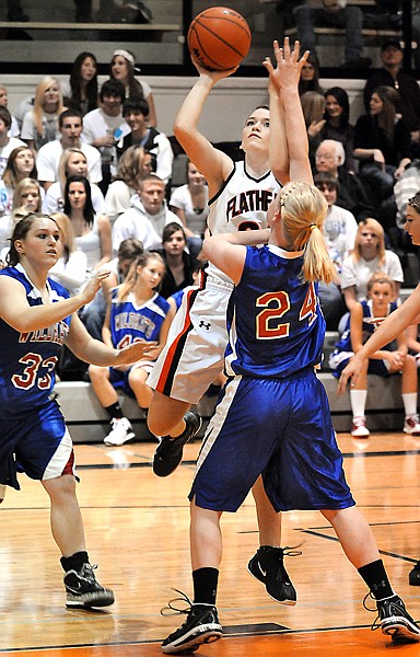 Flathead junior Ashlee O'Dell, 24, shoots for two in the game against Columbia Falls on Thursday night in Kalispell. Flathead won the game 52-41.