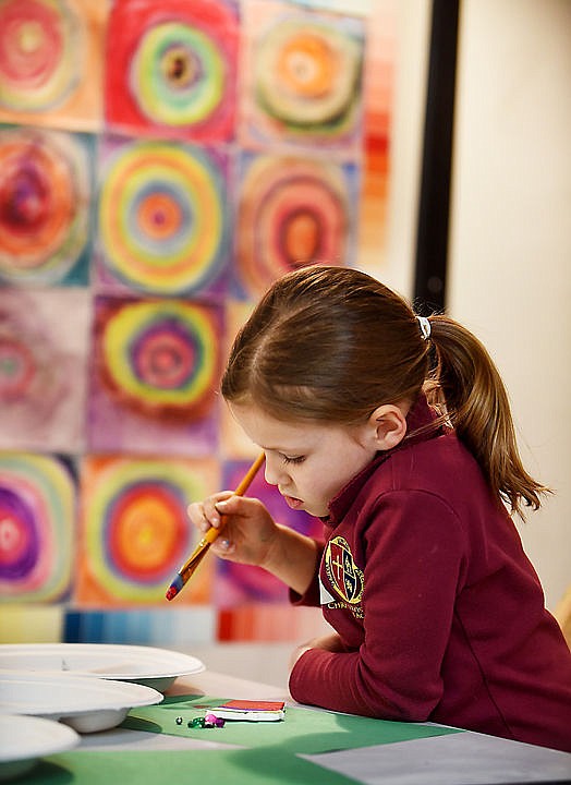 <p>Joanna Glickman, 6, of Whitefish, paints her ceramic ornaments at the Stumptown Art Studio's Santa's Workshop on Monday, Dec. 14, in Whitefish.</p>