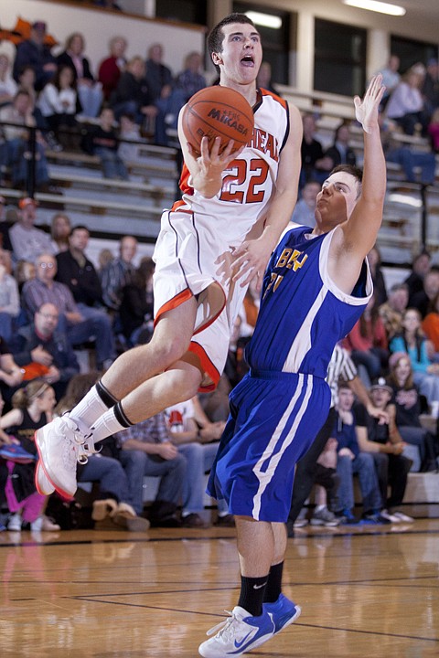 &lt;p&gt;Flathead&#146;s Matt Mclean (22) goes up in front of a Libby defender
for a layup during Saturday&#146;s nonconference basketball game at
Flathead High School.&lt;/p&gt;