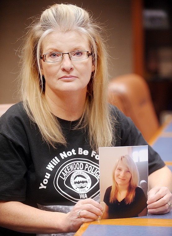 Tammy Gipe of Kalispell holds a photo of her sister Tina Griswold, a Lakewood, Wash., police officer who was killed on duty on Nov. 29.