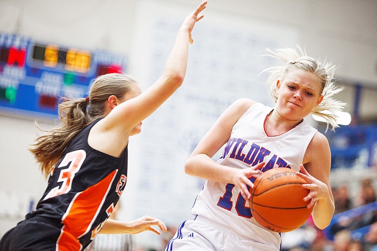 &lt;p&gt;Columbia Falls Wildkats sophomore Ciera Finberg (right) tries to avoid Flathead defender Payton Pietron Friday night during a nonconference matchup at Columbia Falls High School.&lt;/p&gt;