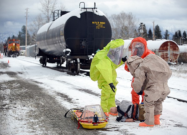 &lt;p&gt;Members of the Kalispell Fire Department Hazmat Team and the Army National Guard 83rd Community Support Team out of Helena arrive on the scene of a mock toxic spill on Tuesday, December 11, in Whitefish. Several agencies joined forces for Tuesday's drill including the Flathead County Office of Emergency Services, the Whitefish, Columbia Falls and Kalispell Fire Departments, the Whitefish Police, the Flathead County Sheriff's Department and many others.&lt;/p&gt;