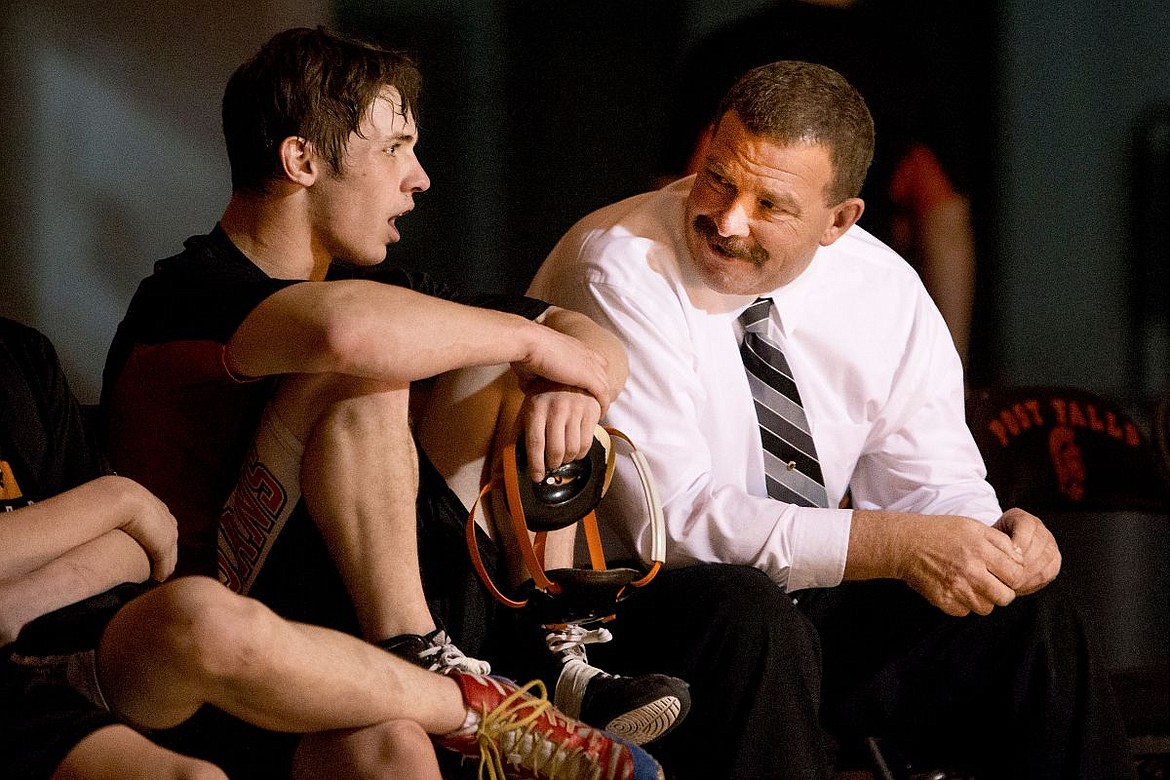 &lt;p&gt;JAKE PARRISH/Press Post Falls senior champion wrestling Tyler Wolf talks with wrestling assistant coach Dave Herndon last Thursday at Post Falls High School.&lt;/p&gt;