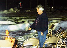 Helen Tookey roasts a marshmallow at the Cooper Tree Lighting event in DeBorgia on Friday.