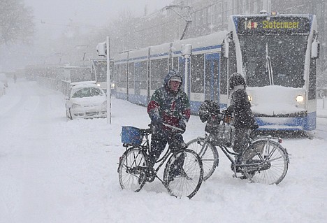 &lt;p&gt;A line of stranded trams is seen as bicyclists try to cross the road in heavy snow in Amsterdam, Friday. The Dutch association of motorists, ANWB, the equivalent of AAA, called the traffic situation in the Netherlands &quot;chaotic.&quot;&lt;/p&gt;