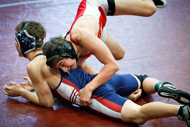 &lt;p&gt;Sandpoint High's Mike Fowler flips into a reversal against Billy Goforth from Mount Spokane High during the 152-pound match Friday at the Tri-State tournament at North Idaho College.&lt;/p&gt;