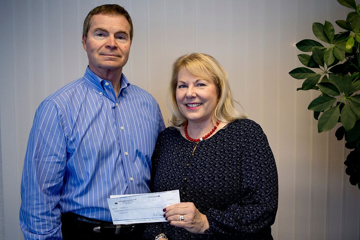 &lt;p&gt;JAKE PARRISH/Press Donald &quot;Pepper&quot; Smock and his wife Midge Smock of Windermere Real Estate of Coeur d'Alene donated $1,000 to the Press' Christmas for All charity on Wednesday. Midge's mother Evamae Kline also donated $250.&lt;/p&gt;