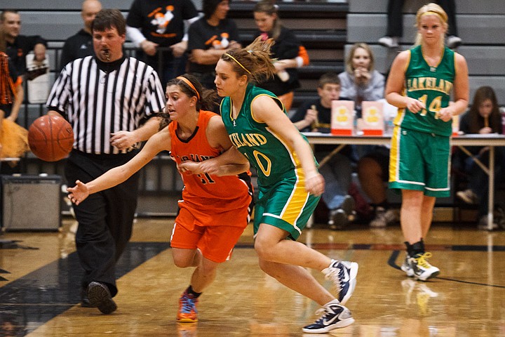 &lt;p&gt;Tori Davenport, of Post Falls, races Lakeland's Toni Tapplin to save a loose ball from going out of bounds Friday during the third quarter of the Prairie Pig 2011.&lt;/p&gt;