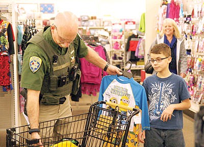&lt;p&gt;Shop With a Cop 2015 with MHP Bryce Ford left, and Marshall Gregory, 11.&lt;/p&gt;