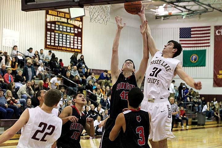 The Chiefs Denis Ulyanchuk blocks a Grizzly shot in the game against Sunnyside in Moses Lake Saturday.