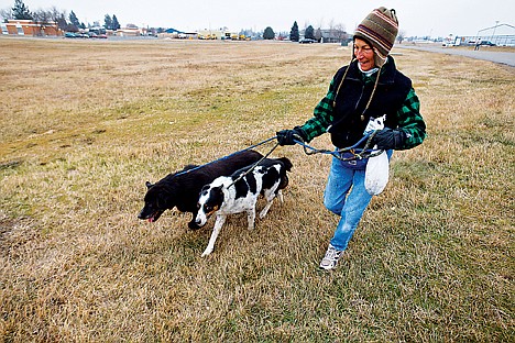 &lt;p&gt;Mary Duval of Hayden walks Warlock, far left, and Skywalker on Tuesday while volunteering for the Kootenai Humane Society. The organization is welcoming Dr. Marty Becker to promote adoption.&lt;/p&gt;