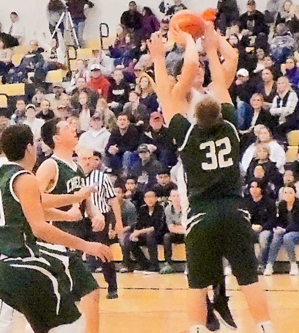 Isaac Ellis goes up for a short shot, but a Chelan defender causes him to go high and miss.