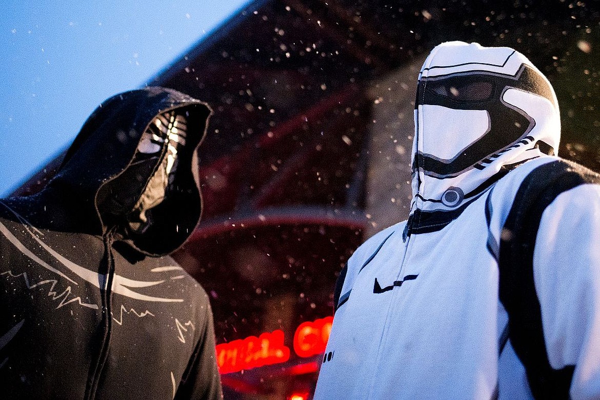 &lt;p&gt;JAKE PARRISH/Press &quot;Star Wars&quot; fanatics Chance Williams, at right and dressed as a Storm Trooper, and brother Nicholas Williams, dressed as Kylo Ren, brave the wet snow as they wait for the start of the premier of &quot;Star Wars: The Force Awakens,&quot; the latest installment in the &quot;Star Wars&quot; series, on Thursday at Regal Cinemas Riverstone in Coeur d'Alene.&lt;/p&gt;