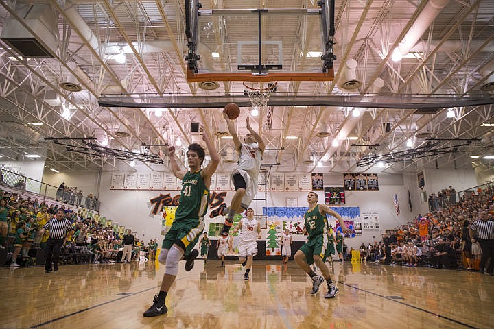 &lt;p&gt;The Lakeland Hawks and Post Falls Trojans competed in their annual basketball rivalry and spirit competition known as Prairie Pig in Post Falls on Friday, Dec. 19, 2014.&lt;/p&gt;