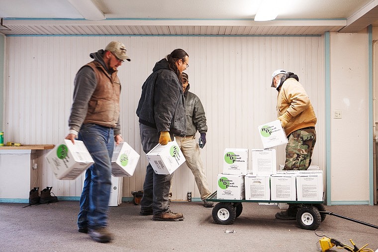 &lt;p&gt;Patrick Cote/Daily Inter Lake Northwest Drywall and Roofing employees unload drywall supplies Wednesday afternoon at the Kelly Main Street Building in downtown Kalispell. Wednesday, Dec. 19, 2012 in Kalispell, Montana.&lt;/p&gt;