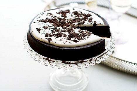 &lt;p&gt;A flourless chocolate cake is shown served on a cake stand.&lt;/p&gt;