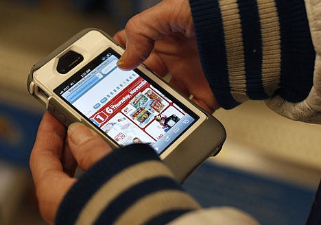 &lt;p&gt;In this Nov. 28 photo, a Target shopper uses her iPhone to compare prices at Wal-Mart while shopping after midnight in South Portland, Maine. Increasingly, buying products online is like trading stocks: you can buy a copper mug or a coat and then hours _ or even minutes later _ it can go up and down in price.&lt;/p&gt;
