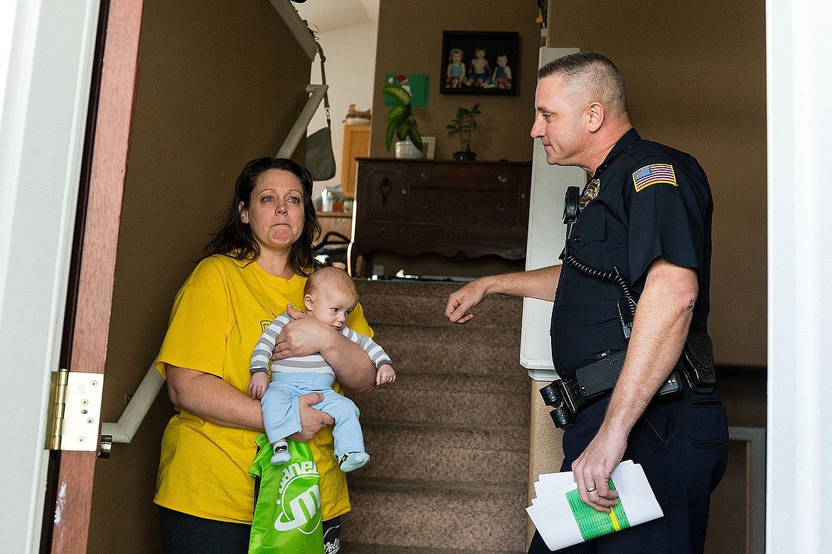 &lt;p&gt;Jessica Plunkett, of Post Falls, is emotional while thanking Captain Pat Knight and other officers from the Post Falls Police Department for their donation.&lt;/p&gt;