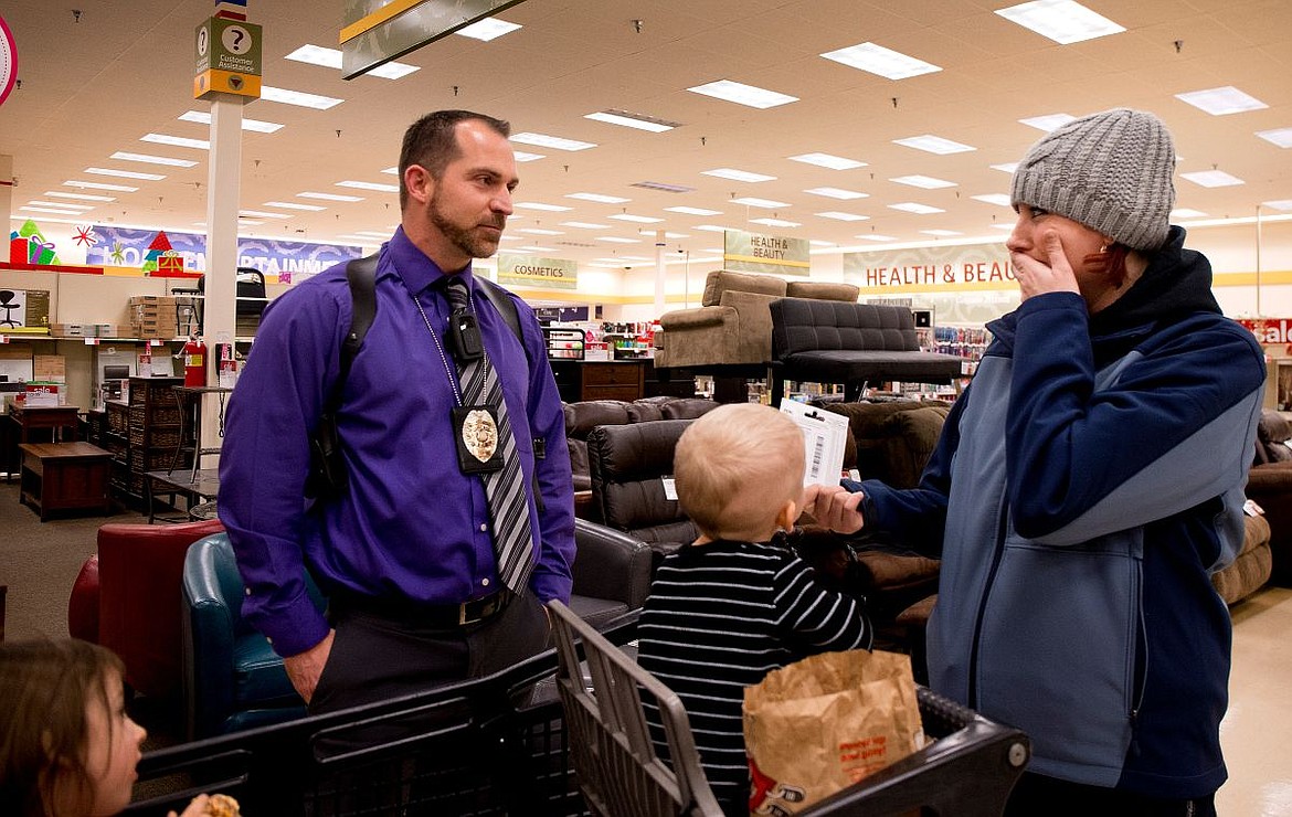 &lt;p&gt;With her children Kaitryn, left, and Logan in the cart, Misty Dawson is surprised by Coeur d'Alene Police Detective Nic Lowry with a $50 Visa gift card from the Coeur d'Alene Police Association on Friday in the Coeur d'Alene Shopko.&#160;&lt;/p&gt;