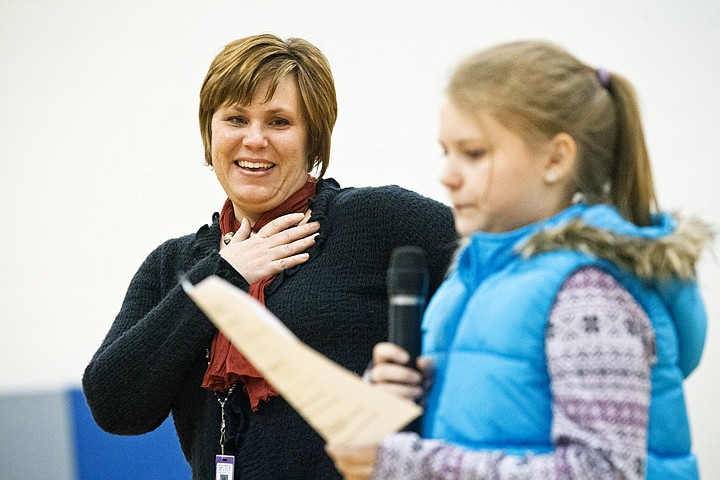 &lt;p&gt;SHAWN GUST/Press Jennifer Nilson, a teacher at Seltice Elementary in Post Falls, reacts as fifth-grader Anya Horn reads her nomination essay Wednesday after Nilson was announced as the November School Champion Award. The award is sponsored by Numerica Credit Union, Silverwood Theme Park, and KXLY.&lt;/p&gt;