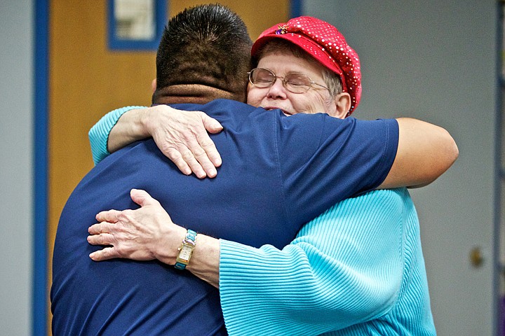 &lt;p&gt;JEROME A. POLLOS/Press Eva Sherrill gives an appreciative hug to Coeur d'Alene Tribal Chairman Chief Allan following a presentation Friday where the Coeur d'Alene Tribe donated $35,000 to the Post Falls Food Bank&Otilde;s new Weekend Nutrition Backpack program. There are currently approximately 75 elementary students participating in the program. Sherrill is one of the 14 volunteers who fills backpacks with foods for children in need.&lt;/p&gt;