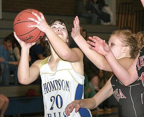 Photo by Sarah Leavenworth&lt;br&gt;Lady Hawk guard Kyla Molzhon eyes the basket as Eureka defenders close in. &lt;br&gt;Molzhon hit three two-point buckets as Thompson Falls surged to a 43-34 win over the Lady Lions.