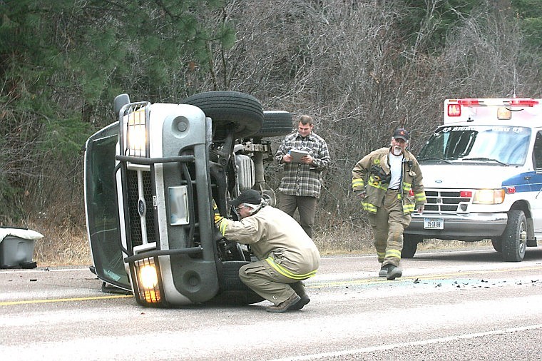 &lt;p&gt;Plains-Paradise Rural Fire District assistant chief Lee Mercier looks for the location of the battery while Lt. Pat Erving secures the scene.&lt;/p&gt;