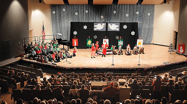 Mathew Martini as Santa and other Kalispell Montessori School students perform in The Penguins Who Saved Christmas on Tuesday at Glacier High School. &quot;We put on the Christmas play annually and involve all the students in the production,&quot; said school administrator Michelle Talus. &quot;Our reason for this is to give all the kids the chance to get up on stage. It gives them the opportunity to gain experience in public speaking, gain self-confidence and also character development.&quot;