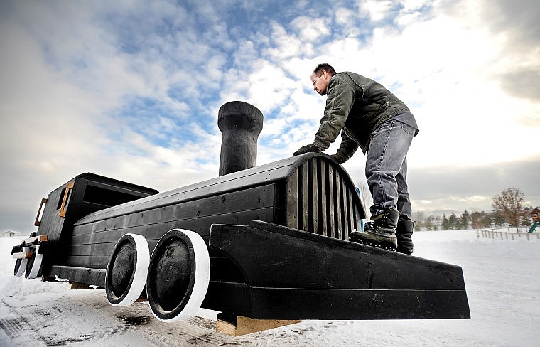 Ranch foreman Todd Fedor of Kalispell uses his body weight to counter-balance a horse jump with a train-engine design as it is moved into storage on Wednesday at Rebecca Farm near Kalispell. The new jumps include a caboose, passenger car, stock train and log train that will be featured on the course next summer for The Event at Rebecca Farm. Rebecca Farm has been awarded another Word Cup qualifier for 2010 that will be part of The Event at Rebecca Farm July 22-25. Rebecca Farm also is exploring the possibility of hosting a World Cup Final here in 2011.