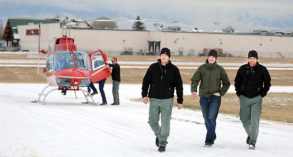 &lt;p&gt;From left, Flathead County Sheriff&#146;s deputies Logan Shawback,
Caleb Pleasants and Scott McConnell walk back to the hangar after
their flight training with Jim Bob Pierce, owner of Red Eagle
Aviation, Monday afternoon in Kalispell. The deputies received
helicopter training with Flathead Emergency Aviation Resources, a
nonprofit volunteer organization that provides air support to
emergency service providers.&lt;/p&gt;