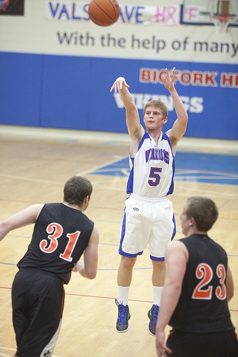 &lt;p&gt;Bigfork's Ian Lorang (5) drains a three-point shot over Eureka's
Chris Ibach (31) and Ryan Holder (23) during the Vikings' win at
home over the Eureka Lions Thursday night.&lt;/p&gt;