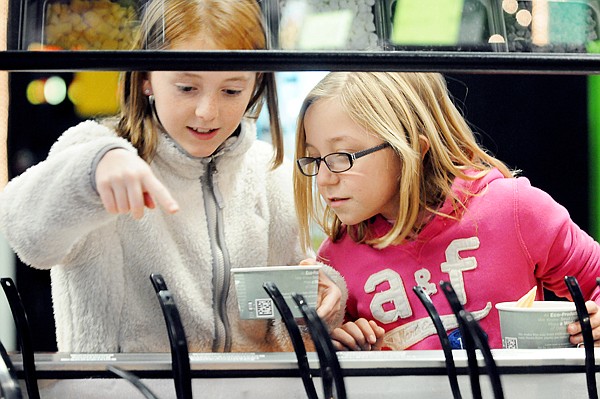 &lt;p&gt;Kennedy Grove, left, and Olivia Olson, both of Whitefish, look
over the various toppin options at Twisted Bliss on Monday night in
Kalispell.&lt;/p&gt;