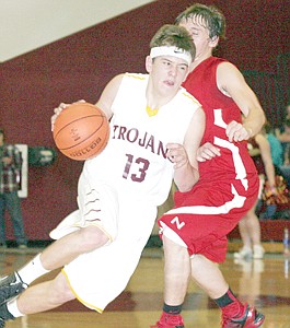 &lt;p&gt;Sophomore guard Gage Tallmadge drives the lane, shot won't go, fouled and 1 for 2 from the line ties the game at 39, fourth quarter vs. Noxon.&lt;/p&gt;