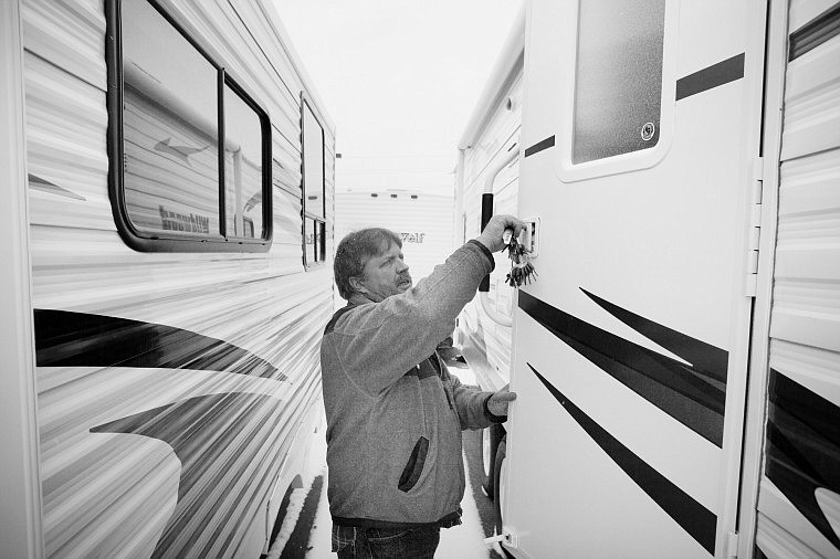 &lt;p&gt;Salesman Brad Dykes unlocks the door of a Wildwood Travel
Trailer at Gardner RV &amp; Trailer Center in Kalispell on Friday
afternoon.&lt;/p&gt;