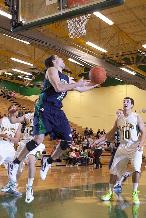 &lt;p&gt;Glacier&#146;s Andy Boyer (3) splits a group of defenders to take a
shot underneath the basket during the Wolfpack&#146;s victory over
Whitefish Friday night at Whitefish High School.&lt;/p&gt;