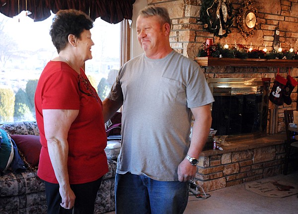 &lt;p&gt;Linda and Dave Smith stand together in their living room on
Friday, December 9, as they pause from packing for Dave's next trip
to North Dakota. Dave left early the next day.&lt;/p&gt;