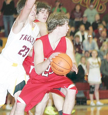 &lt;p&gt;Senior Red Devil Austin Tucker takes control of the ball at the half time buzzer with the score at 21-16 Noxon during the game against Troy.&lt;/p&gt;