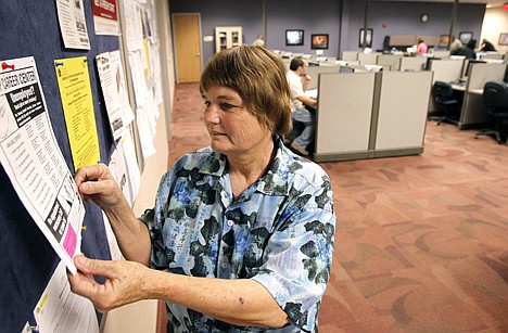 &lt;p&gt;Job seeker Bonnie Rolfe, of Peoria, Ariz., looks at the job postings on a bulletin board at the Maricopa Workforce Connections job center Nov. 18 in Phoenix. Arizona's unemployment rate dropped in October to 9.5 percent, down from 9.7 percent in September, as retailers and other businesses added jobs at a clip that state economists called encouraging.&lt;/p&gt;