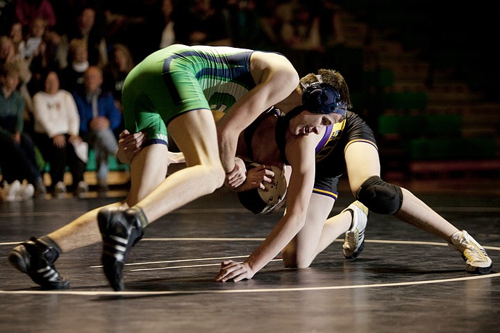 &lt;p&gt;Kaleb Mitchell, left, tries to take down Missoula Sentinel's
Jordan Hegel during Glacier's home dual against the Spartans
Tuesday night.&lt;/p&gt;