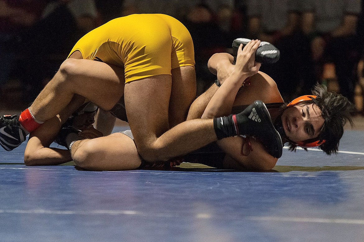 &lt;p&gt;SHAWN GUST/Press Post Falls High School&#146;s Alius De La Rosa fights for control in the final period of the 145-pound championship match.&lt;/p&gt;