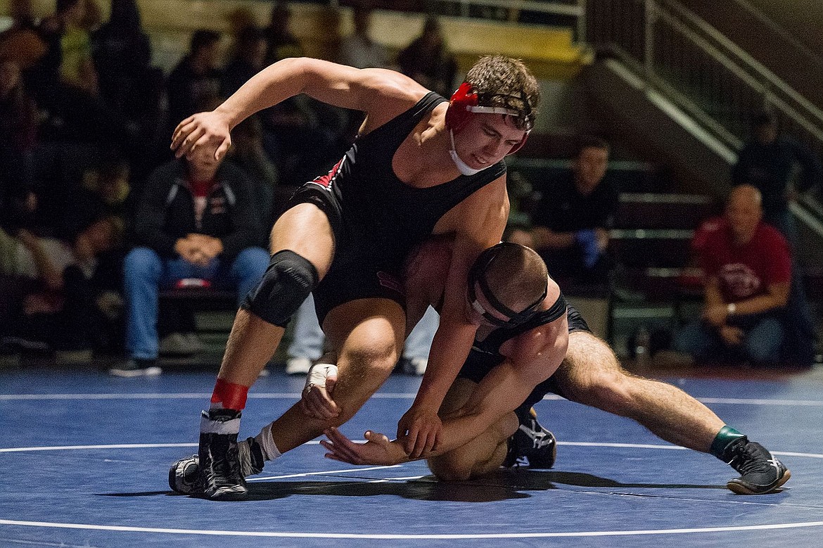 &lt;p&gt;SHAWN GUST/Press Sandpoint High&#146;s Casey Randles defends an outside single-leg shot by University High School&#146;s Levi Meinzinger in the 182-pound match.&lt;/p&gt;