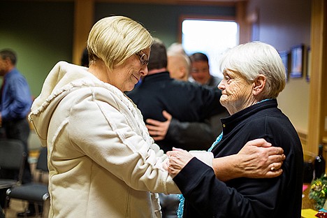 &lt;p&gt;Kathleen Saylor, chair of the library board of trustees, left, shares a moment of reflection with outgoing Coeur d&#146;Alene City Council member Deanna Goodlander Thursday during a party to honor her and Mike Kennedy's service.&lt;/p&gt;