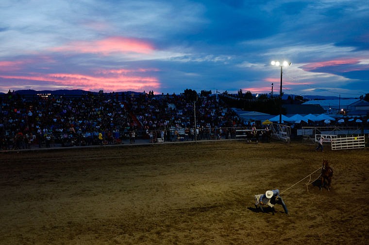 &lt;p&gt;A cowboy competes in tie-down roping Saturday night during the final night of the Northwest Montana Fair Rodeo at the Flathead County Fairgrounds. Aug. 17, 2013 in Kalispell, Montana. (Patrick Cote/Daily Inter Lake)&lt;/p&gt;