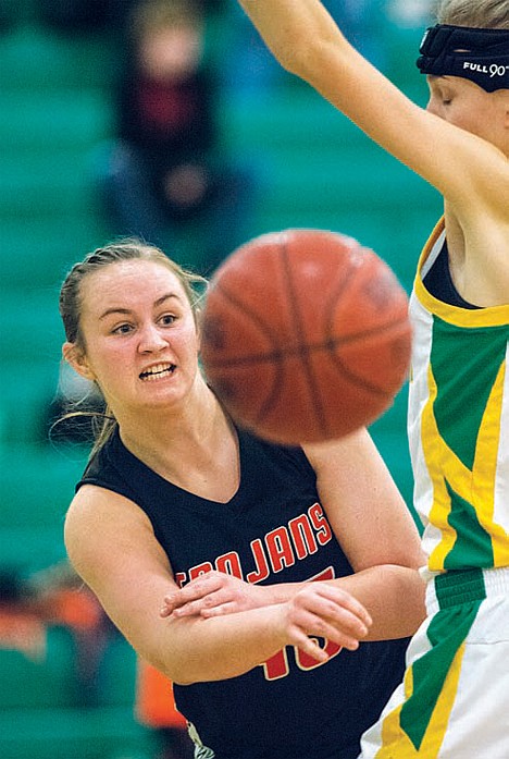 &lt;p&gt;Katie McDermott of Post Falls passes the ball around a Lakeland girl on Friday.&lt;/p&gt;