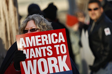 &lt;p&gt;FILE - In this Dec. 8, 2011 file photo, Gwen Williams of Norton Shores listens to speakers outside Rep. Bill Huizenga's Muskegon, Mich. office during a rally calling to extend unemployment insurance benefits, which are set to expire on Dec. 31. (AP Photo/The Muskegon Chronicle, Greg Lindstrom, File) MANDATORY CREDIT&lt;/p&gt;