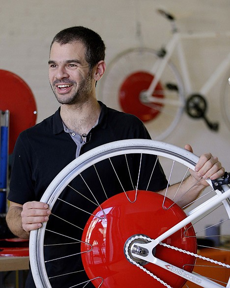 &lt;p&gt;Assaf Biderman, co-inventor of the Copenhagen Wheel and Associate Director of the SENSEable City Laboratory at MIT, poses with his invention at Superpedestrian, his venture-backed company in Cambridge, Mass., on Dec. 12.&lt;/p&gt;