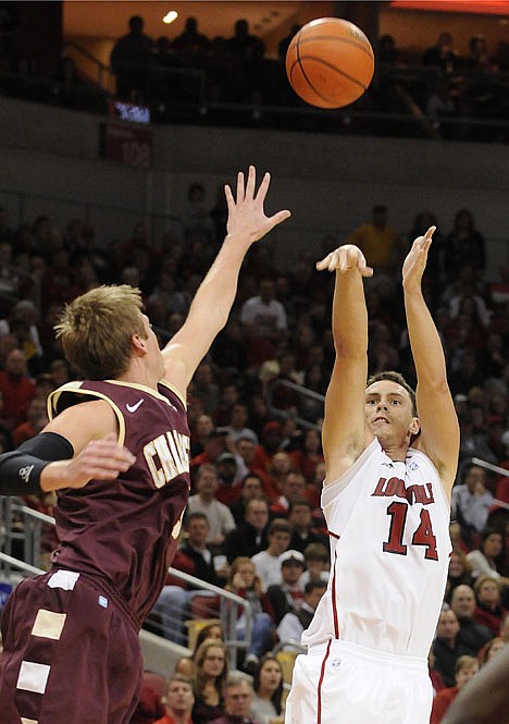 &lt;p&gt;Louisville's Kyle Kuric, right, shoots over the defense of Charleston's Matt Sundberg during the second half of their NCAA college basketball game Tuesday, Dec. 20, 2011 in Louisville, Ky. Louisville defeated Charleston 69-62.(AP Photo/Timothy D. Easley)&lt;/p&gt;